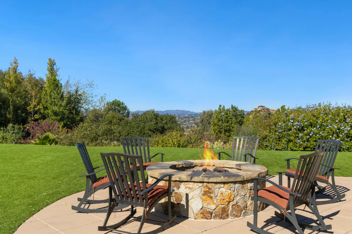 Concrete patio with stone fire pit and seating in Nassau County, NY — Nassau County Concrete
