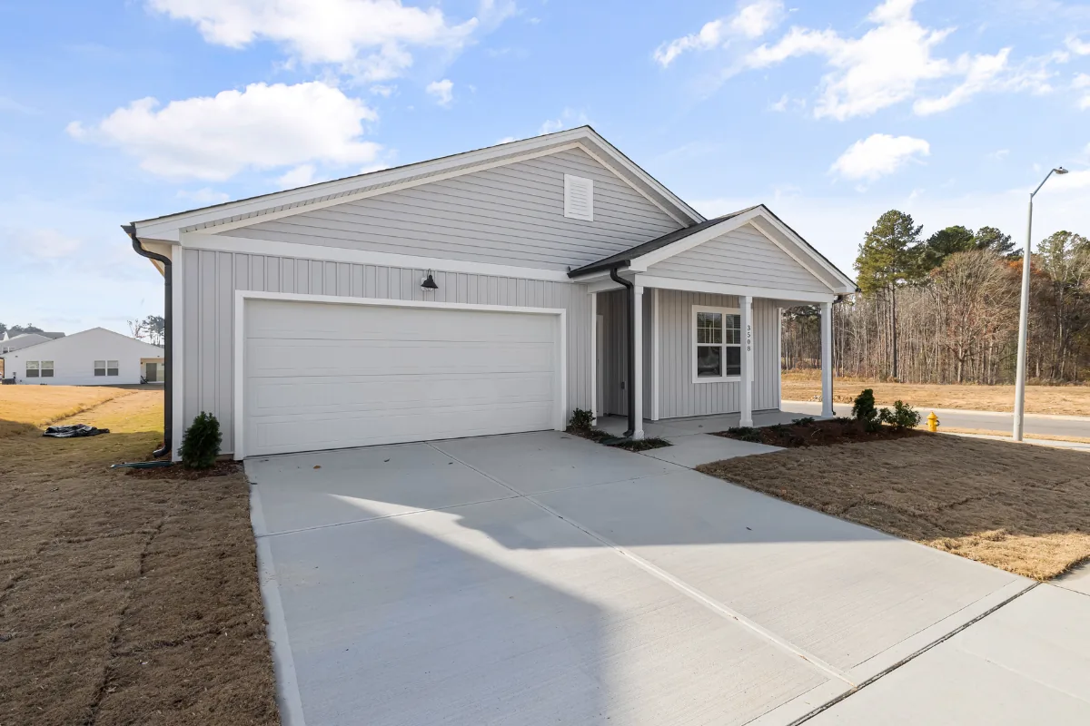 Home with freshly poured concrete driveway in Nassau County, NY — Nassau County Concrete