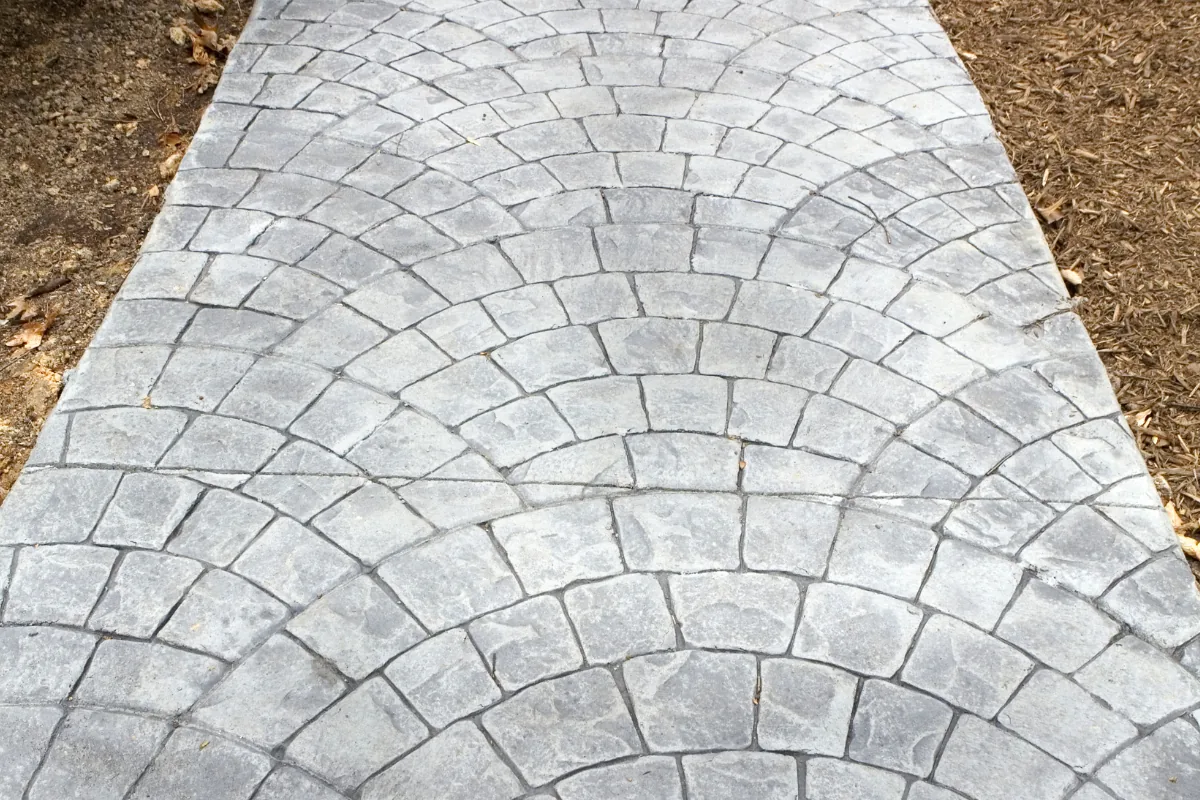 Stamped cobblestone-pattern concrete walkway in Nassau County, NY — Nassau County Concrete